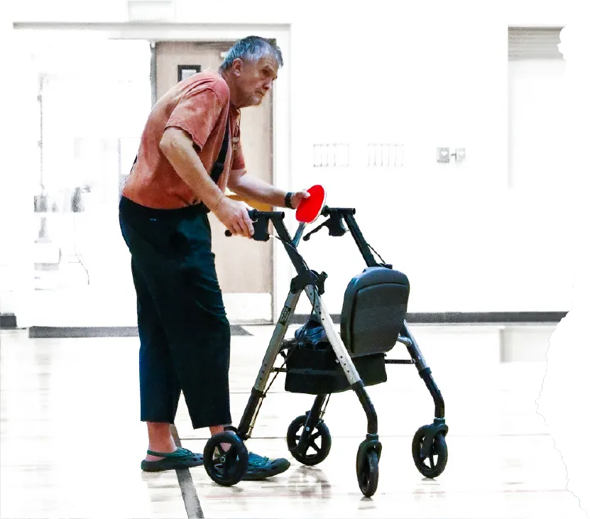 Elderly man walking with Walker